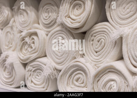 Roll the fabric folded beautifully in the textile shop Stock Photo