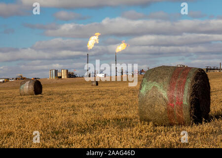 Watford City, North Dakota - Natural gas is flared off at an oil production site in the Bakken shale formation. Stock Photo