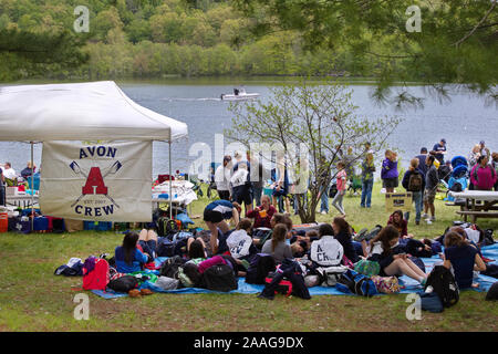 New Preston, CT USA. May 2016. Avon High School Crew banner on food tent beside resting teammates waiting for the next race. Stock Photo