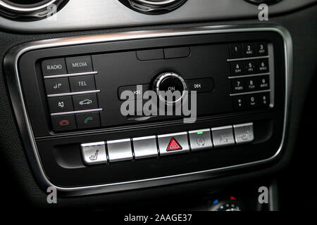 Audio stereo system, control panel and cd in a modern car. Car control panel of audio player and other devices .A shallow depth of field close up of t Stock Photo