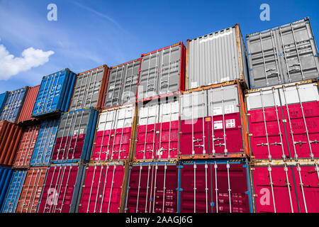 The national flag of Poland on a large number of metal containers for storing goods stacked in rows on top of each other. Conception of storage of goo Stock Photo
