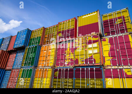 The national flag of Sri Lanka on a large number of metal containers for storing goods stacked in rows on top of each other. Conception of storage of Stock Photo