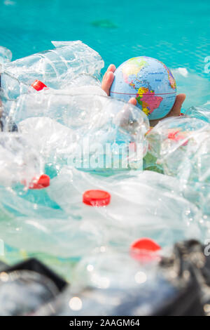 UFA, RUSSIA - JULY 25, 2019 : Problem of trash, plastic recycling, pollution and environmental concept - Plastic rubbish pollution in water environmen Stock Photo