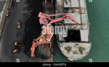 Rizhao. 21st Nov, 2019. Aerial photo taken on Nov. 21, 2019 shows a cargo ship being loaded up with coal at Rizhao Port in Rizhao, east China's Shandong Province. Credit: Wang Kai/Xinhua/Alamy Live News Stock Photo