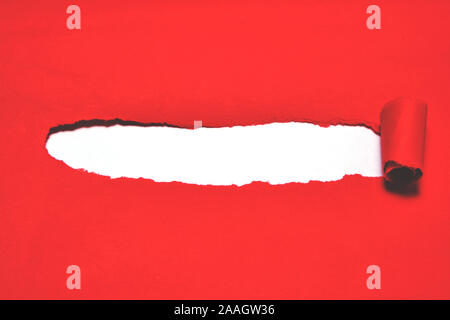 Red torn paper cover with white background. Stock Photo