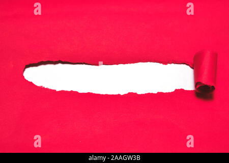 Red torn paper cover with white background. Stock Photo