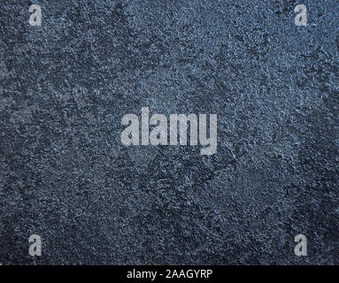 Dark blue marble with a gray tint, polished surface of natural stone. Close-up. Stock Photo