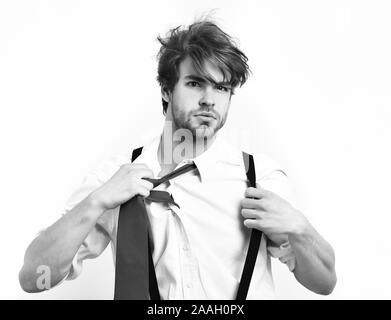 Bearded man, short beard. Caucasian stylish manager with moustache in red tie, shirt with suspenders posing in studio isolated on white background Stock Photo