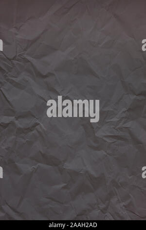 Black crumpled wrinkled textured paper background. Empty space Stock Photo