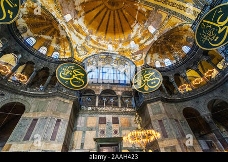 HAGIA SOPHIA ISTANBUL TURKEY INTERIOR THE DOME AND FOUR LARGE ROUNDED CALLIGRAPHIC PANES IN ARABIC Stock Photo