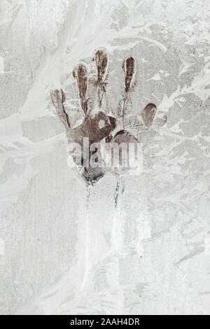 handprint on a frozen window Stock Photo