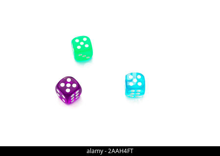 number five on the edges of the die, three multi-colored dice on a white background Stock Photo