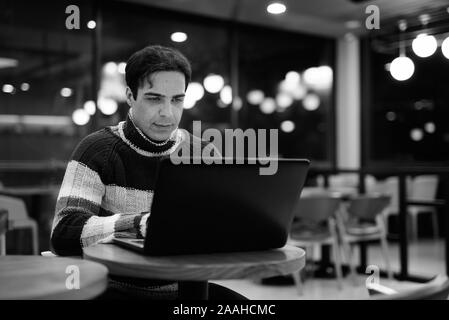 Handsome Persian man relaxing at the coffee shop Stock Photo