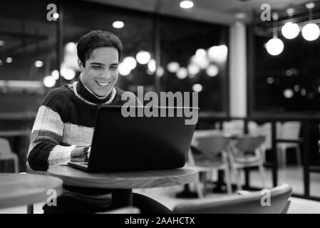 Handsome Persian man relaxing at the coffee shop Stock Photo