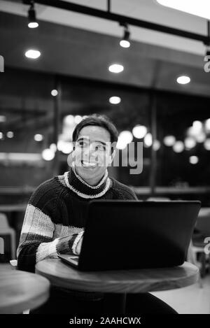 Handsome Persian man relaxing at the coffee shop Stock Photo