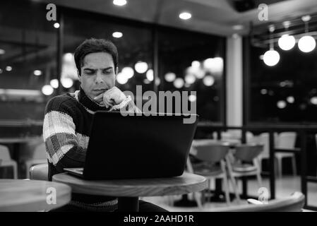 Handsome Persian man relaxing at the coffee shop Stock Photo