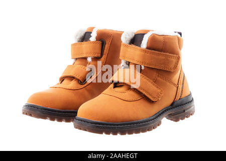 Waterproof female winter shoes isolated on white background. Yellow boots. Stock Photo