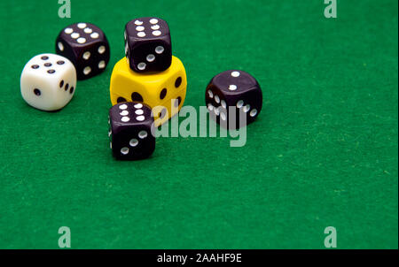 Different in color dice on a green background. Stock Photo
