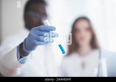Experiments in the chemical laboratory. An experiment was carried out in a laboratory in transparent flasks Stock Photo