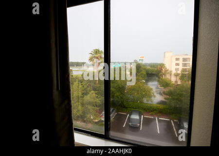 looking out of an upper floor hotel room in heavy rain thunderstorm in jacksonville florida usa Stock Photo