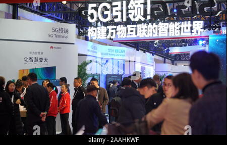 Beijing, China. 21st Nov, 2019. Visitors look at the 5G intelligent system exhibition booth of China's Huawei at the 2019 World 5G Convention in Beijing, capital of China, Nov. 21, 2019. Credit: Li Xin/Xinhua/Alamy Live News