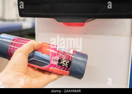 close up consumer check the price in the store using rfid scanners Stock Photo