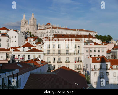 The C17th church of St. Vincent Outside the Walls seen on the skyline above rooftops in Lisbon Portugal Stock Photo