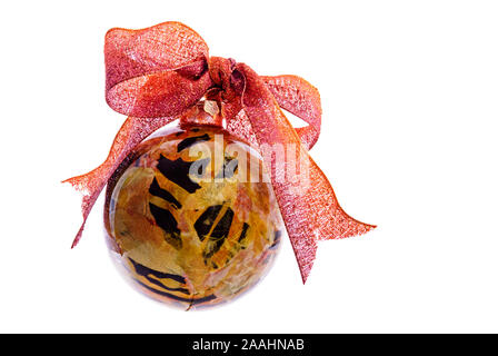 Handmade and unique decoupage gold and copper colored Christmas tree ornament isolated on a white background. Stock Photo