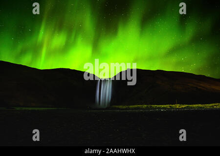 The Aurora Borealis (Northern Lights) at Skógafoss Waterfalls (Iceland) Stock Photo