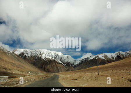 View landscape with Himalayas mountains and between journey Pangong Tso high grassland lake go to Leh Ladakh on Pangong lake road and Khardung La Road Stock Photo