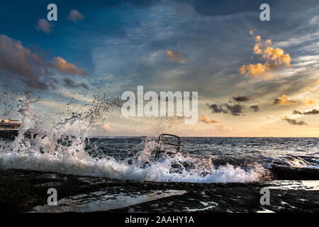 ocean waves against the harbor Stock Photo