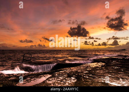 ocean waves against the harbor Stock Photo