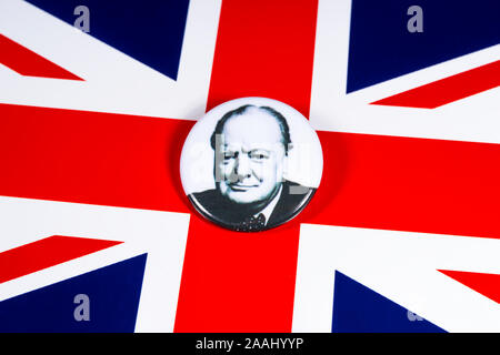 London, UK - November 21st 2019: A pin badge with a portrait of famous Briton Sir Winston Churchill, pictured over the flag of the United Kingdom. Stock Photo