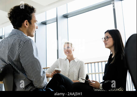 Businessman and businesswomen at meeting in office Stock Photo