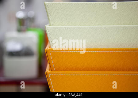 The goods for a toilet and a bathroom presented in shop on a shelf, baskets for linen and garbage, brushes for a toilet bowl, various accessories in b Stock Photo