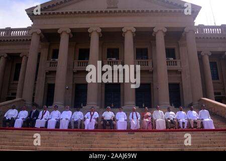 (191122) -- COLOMBO, Nov. 22, 2019 (Xinhua) -- Sri Lankan President Gotabaya Rajapaksa and new ministers take a group photo after taking oaths at the Presidential Secretariat in Colombo, Sri Lanka, Nov. 22, 2019. Sri Lankan President Gotabaya Rajapaksa on Friday appointed a new 16 member cabinet which will function till the next parliamentary election is announced. The new ministers took oaths in front of the president at the Presidential Secretariat in capital Colombo. (Photo by Gayan Sameer/Xinhua) Stock Photo