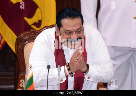 (191122) -- COLOMBO, Nov. 22, 2019 (Xinhua) -- Sri Lanka's former president Mahinda Rajapaksa who was appointed as new prime minister is appointed as the new minister of Finance, Economic Affairs, Policy Development, Buddha Sasana, Cultural, Water Supply and Urban Development and Housing Affairs at the Presidential Secretariat in Colombo, Sri Lanka, Nov. 22, 2019. Sri Lankan President Gotabaya Rajapaksa on Friday appointed a new 16 member cabinet which will function till the next parliamentary election is announced. The new ministers took oaths in front of the president at the Presidential Sec Stock Photo