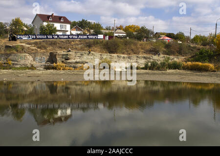 UMAN, UKRAINE - OCTOBER 02, 2016 - Orthodox Jewish pilgrims pray near the lake during celebrating Rosh Hashana in Uman, Ukraine Stock Photo