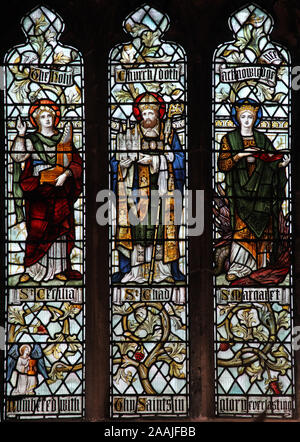 A stained glass window by Burlison & Grylls depicting Saints Cecilia, Chad and Margaret, Bangor Cathedral, Bangor, Gwynedd, Wales Stock Photo