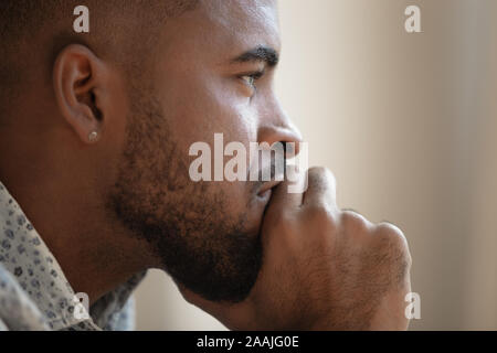 Close up of pensive biracial man thinking having problem Stock Photo