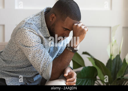 Pensive african American man thinking over problem Stock Photo