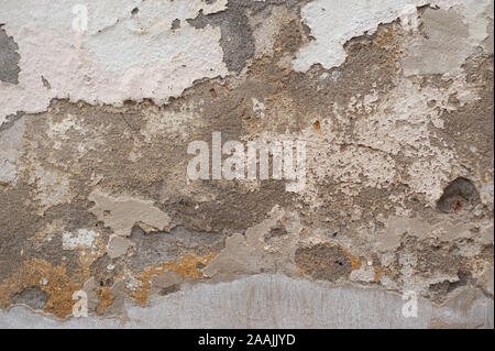 Detail of old wall with cracked plaster. Stock Photo