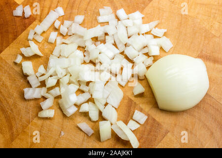 Chopped onions on a wooden chopping board Stock Photo