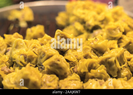 some kind of dumpling that can call Dim sum. it put pork inside and cover with yellow flour Stock Photo