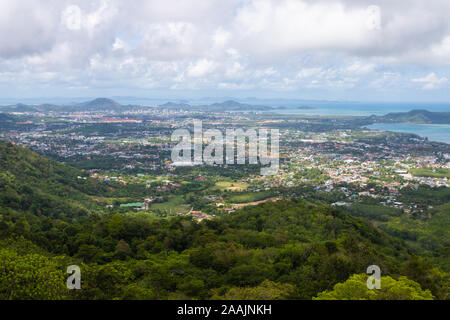 Phuket city scape from high hill ground, can see both town and the beach with cloudy sky Stock Photo