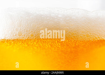 Light Beer with Bubbles and Foam Background on White. Beer Bubbles Texture Close Up Stock Photo