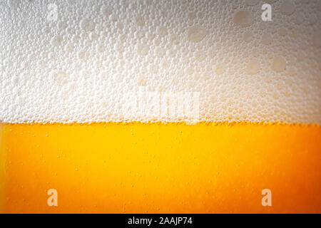 Light Beer with Bubbles and Foam Background. Beer Bubbles Texture Close Up Stock Photo