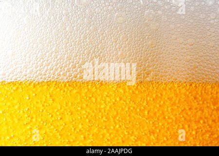 Light Beer with Bubbles and Foam Background. Beer Bubbles Texture Close Up Stock Photo