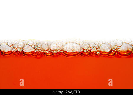 Dark Beer with Bubbles and Foam Background. Beer Bubbles Texture Closeup Stock Photo