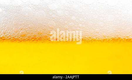 Light Beer with Bubbles and Foam Background. Beer Bubbles Texture Close Up Stock Photo